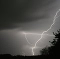 Image of thunder lightning against grey stormy sky with copy space