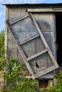 Tilted picture frame structure on metal siding of abandoned building background asset Royalty Free Stock Photo