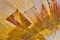 Tilted shot of curved wall of golden and earth tone brick wall abstract background asset