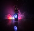 Image of a time bomb against dark background. Timer counting down to detonation illuminated in a shaft light shining through the Royalty Free Stock Photo