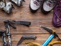 Image on top of ski poles, boots, picks on wooden background.