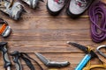 Image on top of ski poles, boots, picks on wooden background.