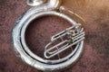 Image, top view, instrument Sousaphone in a marching band laying on the ground