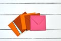 Image of a top view of multi-colored envelopes on a white wooden table. Royalty Free Stock Photo
