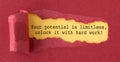 The image is a torn piece of paper with the words Your potential is limitless, Unlock it With Hard Work written on it. Royalty Free Stock Photo