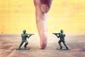 Image of toy soldiers over wooden table Royalty Free Stock Photo