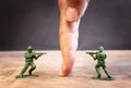 image of toy soldiers over wooden table Royalty Free Stock Photo