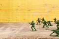 image of toy soldiers over wooden table Royalty Free Stock Photo