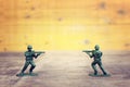 image of toy soldiers over wooden table Royalty Free Stock Photo