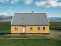 Traditional turf covered house in Glaumbaer, northwestern Iceland. Agricultural fields with horses, and snow-covered mountains in Royalty Free Stock Photo