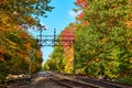 Train tracks empty through fall forest in Maine Royalty Free Stock Photo
