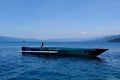 Tranquil scene with fishing boat on Lake Matano