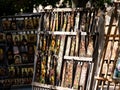 some very pretty religious items by a tree on a street