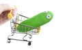 Image of trolley hand toy rubber cucumber white background Royalty Free Stock Photo