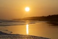 Tropical beach with warm sunset at dusk time