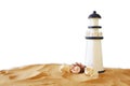 Image of tropical sandy beach, lighthouse and seashells Royalty Free Stock Photo