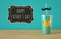 Image of turquoise cup with golden heart. Father& x27;s day concept. Royalty Free Stock Photo