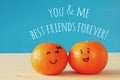 Image of two clementines with drawn smiley faces Royalty Free Stock Photo