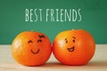 Image of two clementines with drawn smiley faces Royalty Free Stock Photo