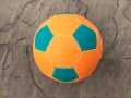 A two color football isolated on stone background