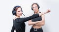 Image of two funny women with headsets. Customer support concept Royalty Free Stock Photo