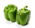 Two green sweet bell peppers are isolated on white.