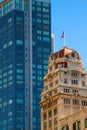 Image of two landmarks in San Francisco demonstrating the opposition between beautiful old historic brick building and a modern gl