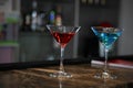 Image of two martini glasses filled with cocktails standing on the bar counter Royalty Free Stock Photo