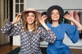 Smiling amazing young women wearing hats. Royalty Free Stock Photo