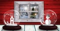 Image of two snow globes with snowman and church tower with winter scenery seen through window Royalty Free Stock Photo