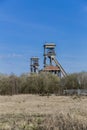 Towers of a mine in remodeling on a sunny day with a blue sky Royalty Free Stock Photo