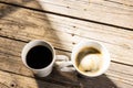 Image of two white cup of black coffee on wooden background Royalty Free Stock Photo
