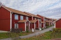 Image of Typical scandinavian style street with red wooden apartment houses Royalty Free Stock Photo