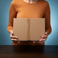 Image Unboxing elegance Female hands reveal an empty brown cardboard box Royalty Free Stock Photo