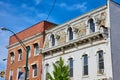 Unique colorful tile siding on white brick roof adjoined to red brick building in Public Square