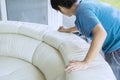 Unknown male worker wiping white leather couch Royalty Free Stock Photo