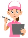 Upper body of a woman wearing a pink polo shirt and hat filling out a form Royalty Free Stock Photo