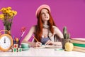 Image of uptight teenage girl studying with exercise books while sitting at desk Royalty Free Stock Photo