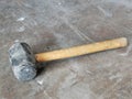 Image of used rubber hammer on the metal table. Royalty Free Stock Photo