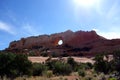Red Rock Wall with Natural Arch Hole Royalty Free Stock Photo
