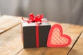 Image of Valentine`s day, symbols of love, gift box on a background of wooden planks Royalty Free Stock Photo