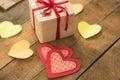 Image of Valentine`s day, symbols of love, gift box on a background of wooden planks. 2 Royalty Free Stock Photo