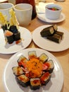 Image of various kinds of sushi on the table