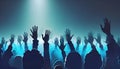 image of the a vast crowd of hands, illuminated by a dreamy and foggy light towards the front auditorium.