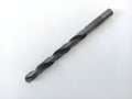 image of a very sharp black iron drill bit made from very strong steel
