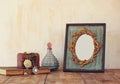 Image of victorian vintage antique classical frame, jewelry and perfume bottle Royalty Free Stock Photo