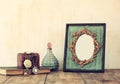 Image of victorian vintage antique classical frame, jewelry and perfume Royalty Free Stock Photo