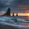 View from cape Dyrholaey on Reynisfjara Beach and Reynisdrangar basalt sea stacks, Iceland. Stormy sunrise made with Royalty Free Stock Photo