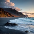 Vik, Iceland - October 14, 2021: Clouds roll over the black sand beaches of the town as the dramatic landscape creates