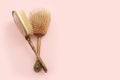 Image of vintage hair comb over pastel pink background